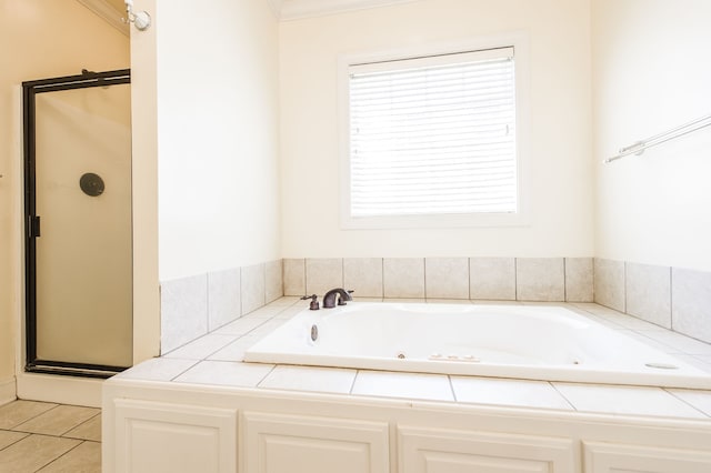 bathroom featuring tile patterned floors and separate shower and tub