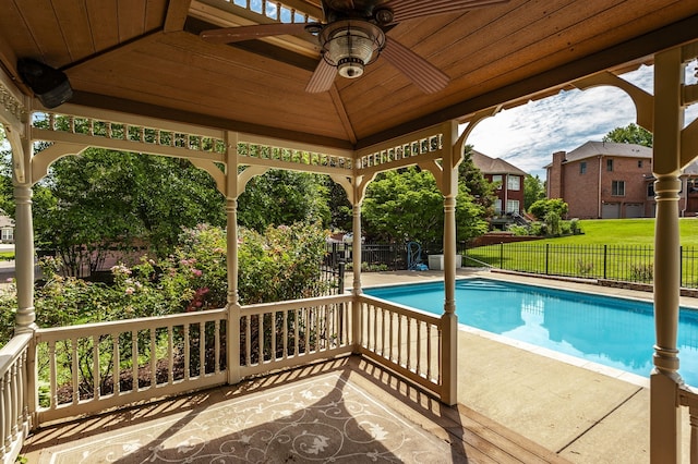 view of pool featuring a gazebo, a yard, and ceiling fan