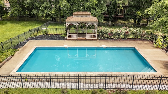 view of swimming pool featuring a lawn, a patio area, and a gazebo