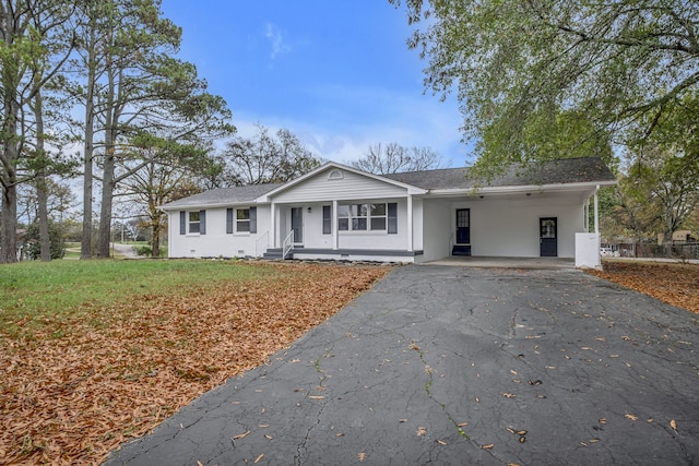 single story home with a front lawn and a carport