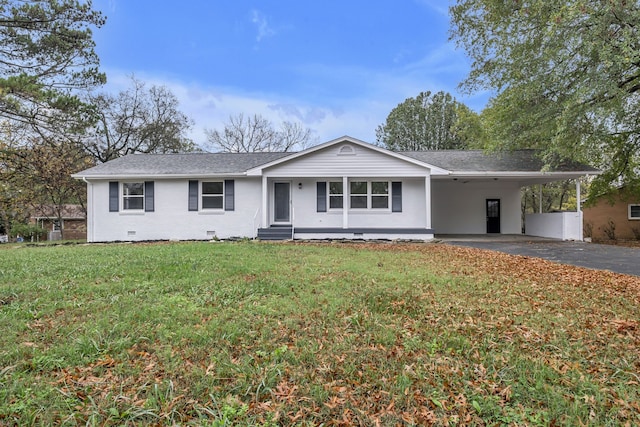 ranch-style house featuring a front lawn and a carport