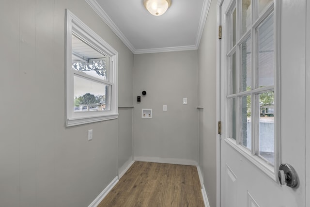 doorway to outside with hardwood / wood-style flooring and ornamental molding