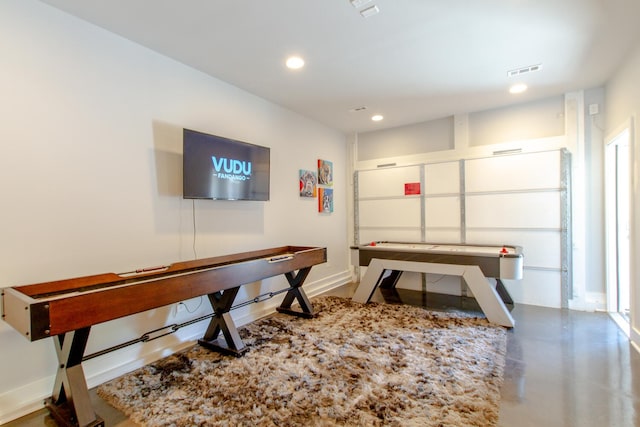 game room with concrete flooring