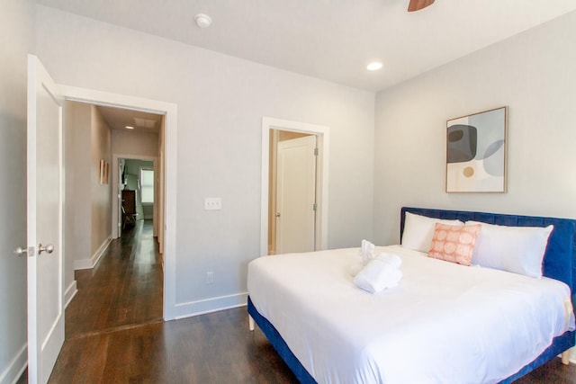 bedroom with dark wood-type flooring