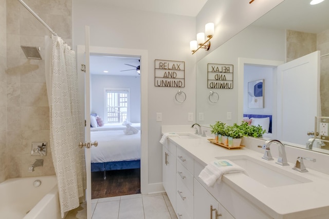 bathroom with tile patterned flooring, vanity, ceiling fan, and shower / bath combo with shower curtain