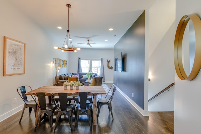 dining space with dark hardwood / wood-style flooring and ceiling fan