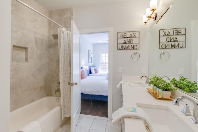 bathroom featuring hardwood / wood-style flooring, vanity, and shower / bathtub combination with curtain