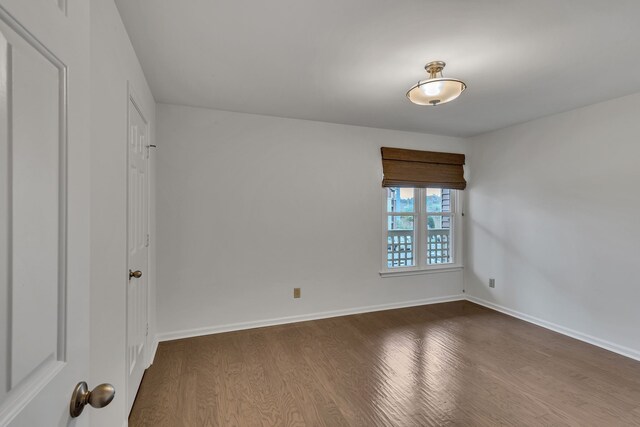 spare room with hardwood / wood-style floors