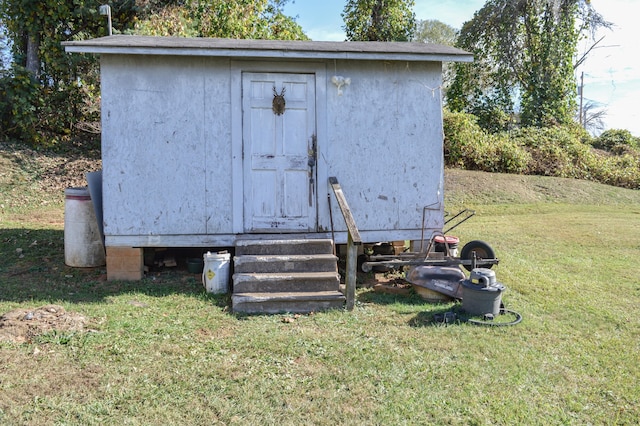 view of outdoor structure with a lawn