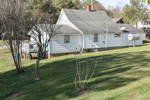 back of property featuring a lawn