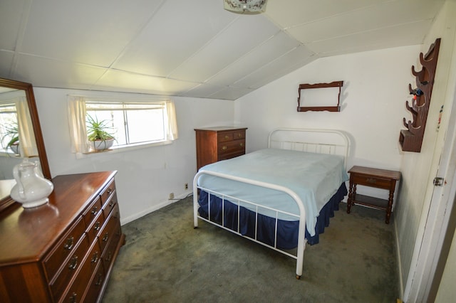 carpeted bedroom featuring lofted ceiling