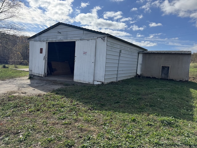 view of outdoor structure with a lawn