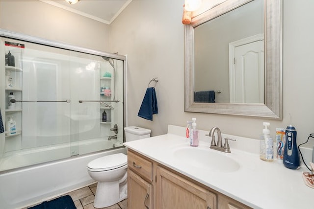 full bathroom featuring tile patterned floors, toilet, combined bath / shower with glass door, vanity, and crown molding