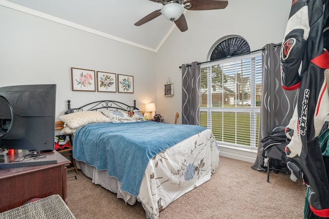 bedroom with ceiling fan, ornamental molding, lofted ceiling, and carpet