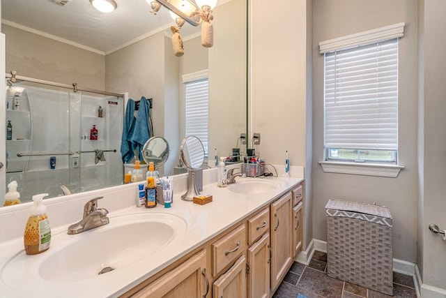 bathroom with walk in shower, vanity, and crown molding