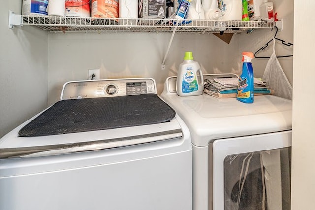 laundry room with washing machine and clothes dryer