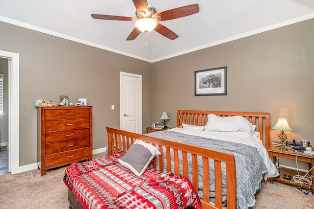 carpeted bedroom featuring ornamental molding and ceiling fan