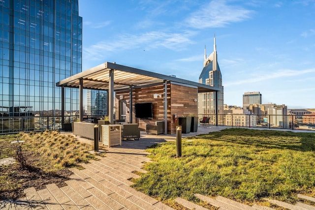 view of property's community with a patio and a yard