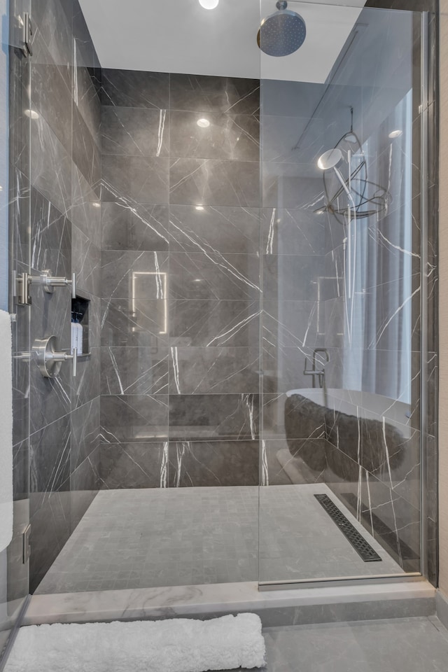 bathroom with a shower with shower door