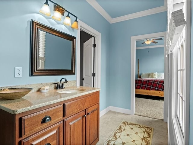 bathroom featuring tile patterned flooring, vanity, ceiling fan, and crown molding