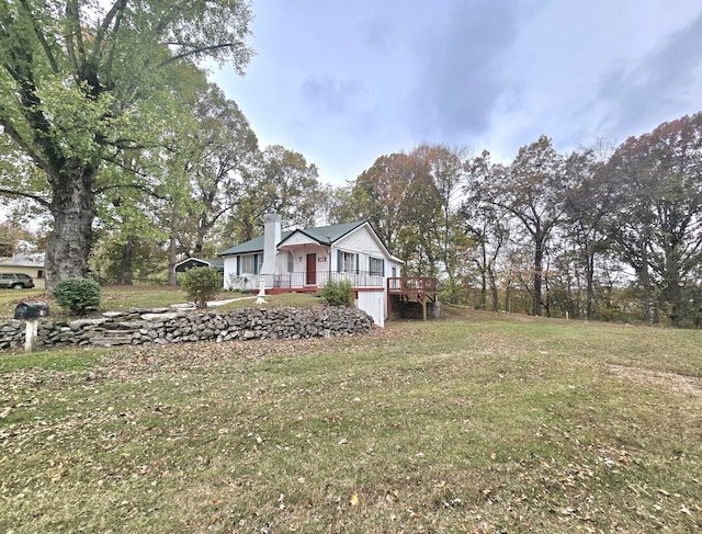 exterior space featuring a front yard and a deck