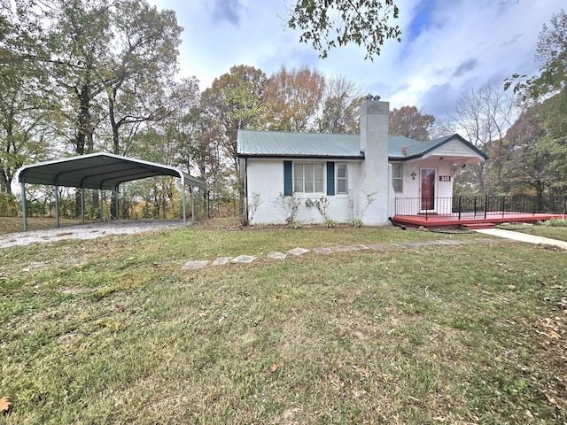 ranch-style house with a carport, a front lawn, and a wooden deck