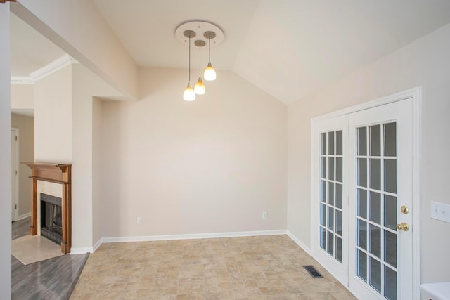 unfurnished dining area with lofted ceiling and ornamental molding