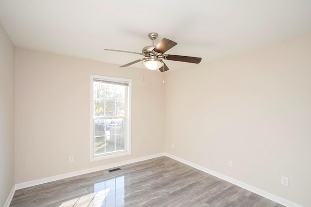 spare room with ceiling fan and light hardwood / wood-style floors