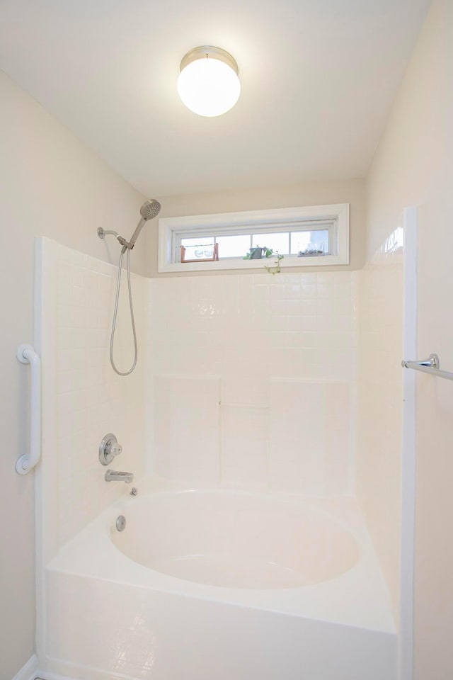 bathroom with washtub / shower combination