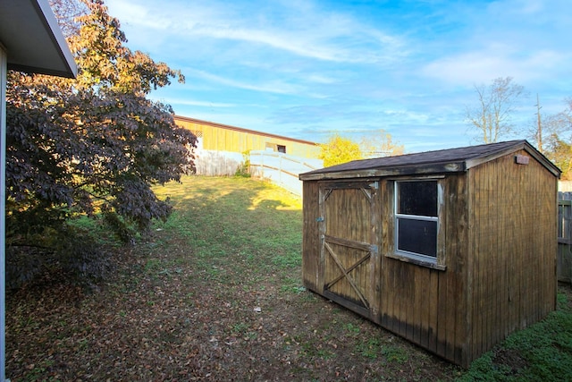 view of outdoor structure with a lawn