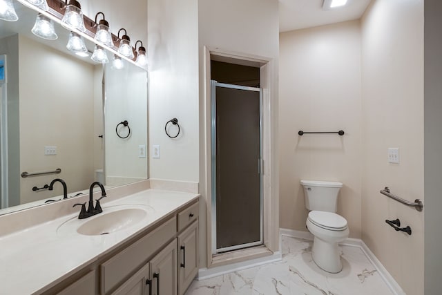 bathroom featuring vanity, toilet, and an enclosed shower