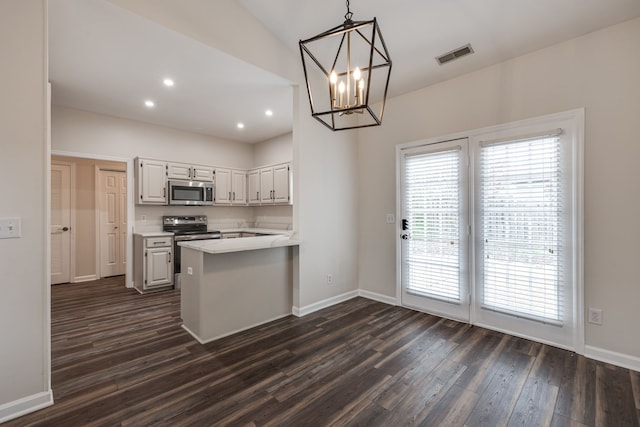 kitchen featuring white cabinetry, appliances with stainless steel finishes, dark hardwood / wood-style flooring, pendant lighting, and kitchen peninsula