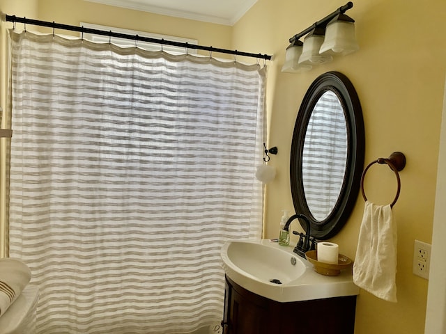 bathroom featuring vanity and crown molding