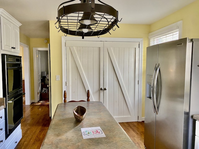 dining room with dark wood-type flooring