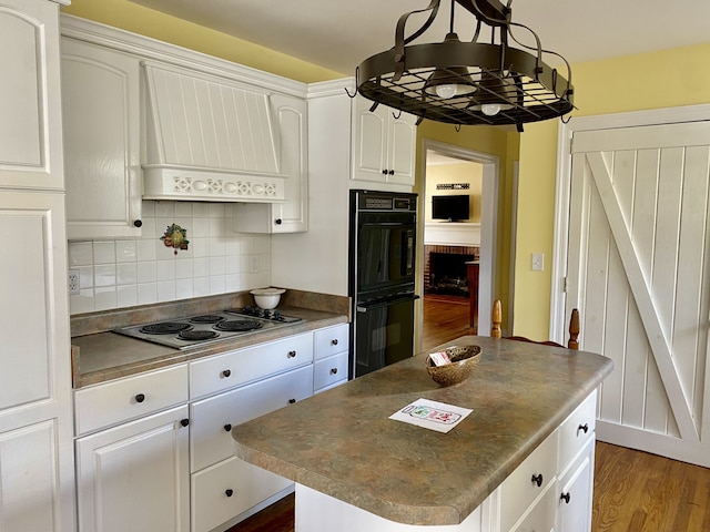 kitchen with custom exhaust hood, dark hardwood / wood-style floors, double oven, white cabinetry, and white electric stovetop