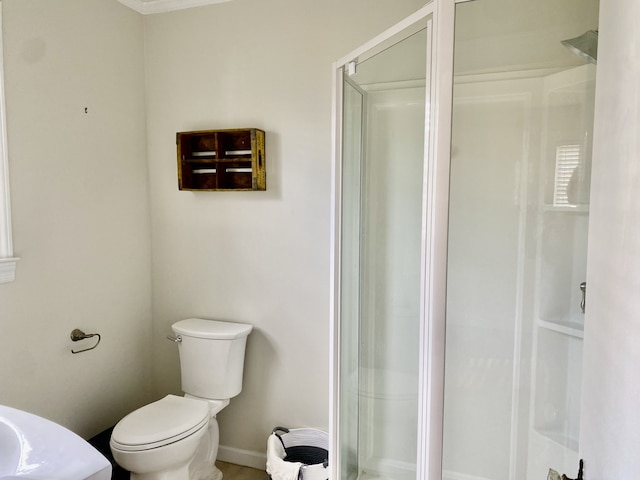 bathroom with walk in shower and toilet