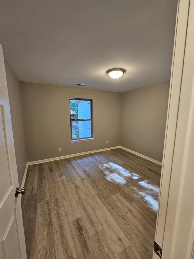 empty room with light hardwood / wood-style floors