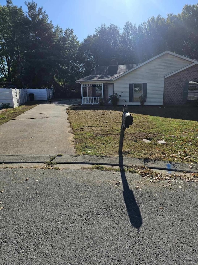 view of front of home with a front lawn