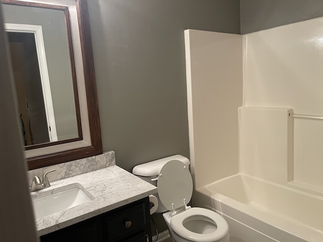 full bathroom featuring vanity, shower / washtub combination, and toilet