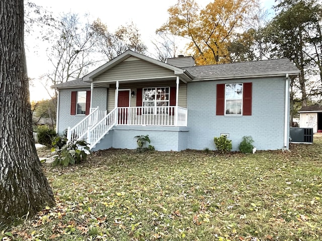 view of front of house with cooling unit, a front lawn, and a porch