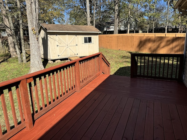 wooden terrace featuring a storage shed