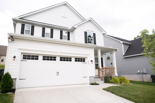 view of front of home with a garage and a front yard