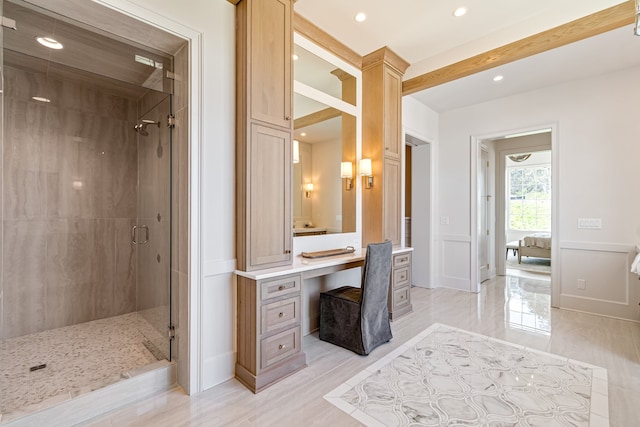 full bath featuring a stall shower, a wainscoted wall, vanity, a decorative wall, and recessed lighting