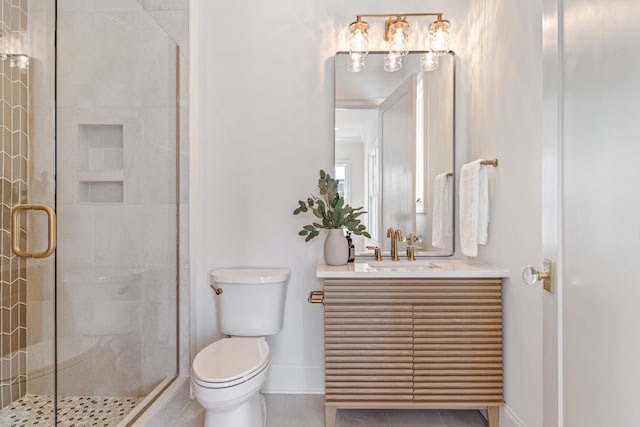 full bath featuring baseboards, toilet, tile patterned floors, vanity, and a shower stall