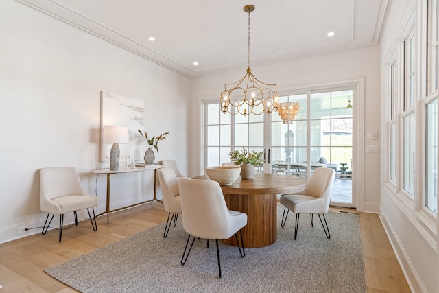 dining area with light wood-type flooring, baseboards, ornamental molding, and recessed lighting