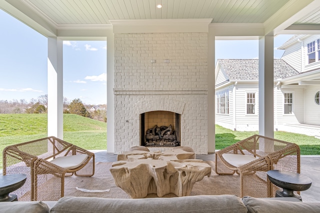 view of patio featuring an outdoor brick fireplace