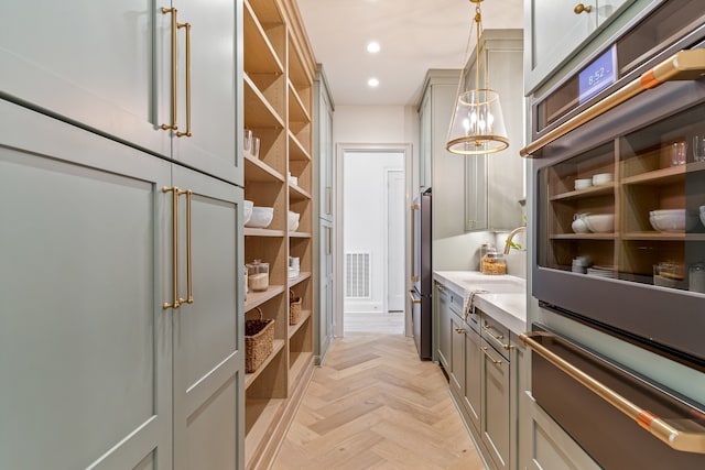 pantry with visible vents and a sink