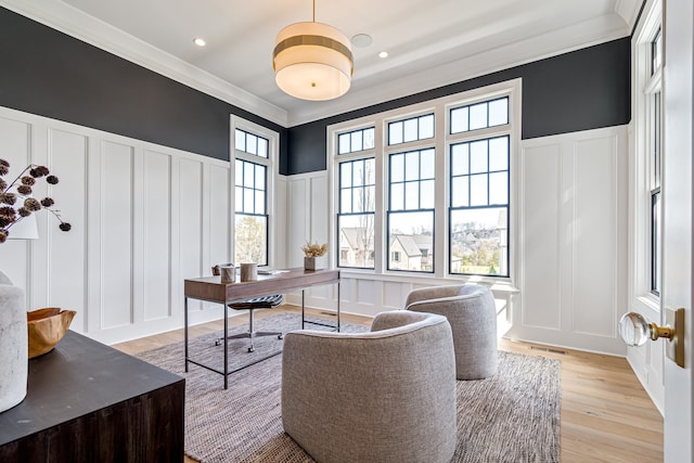 office with ornamental molding, a wealth of natural light, and a decorative wall