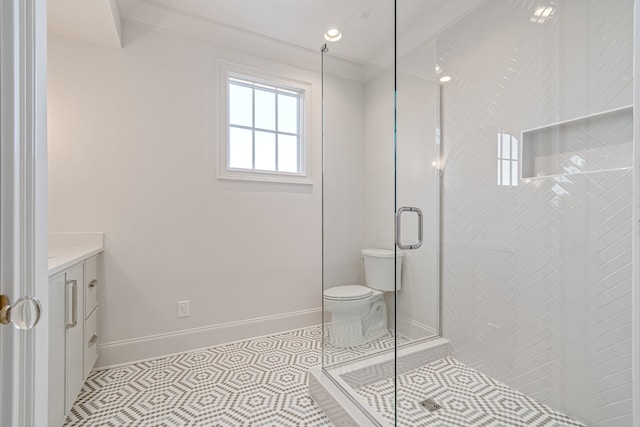 bathroom featuring baseboards, a shower stall, toilet, and tile patterned floors