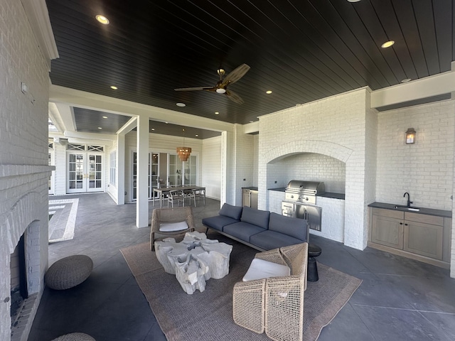 view of patio / terrace with french doors, grilling area, area for grilling, outdoor dining space, and a sink